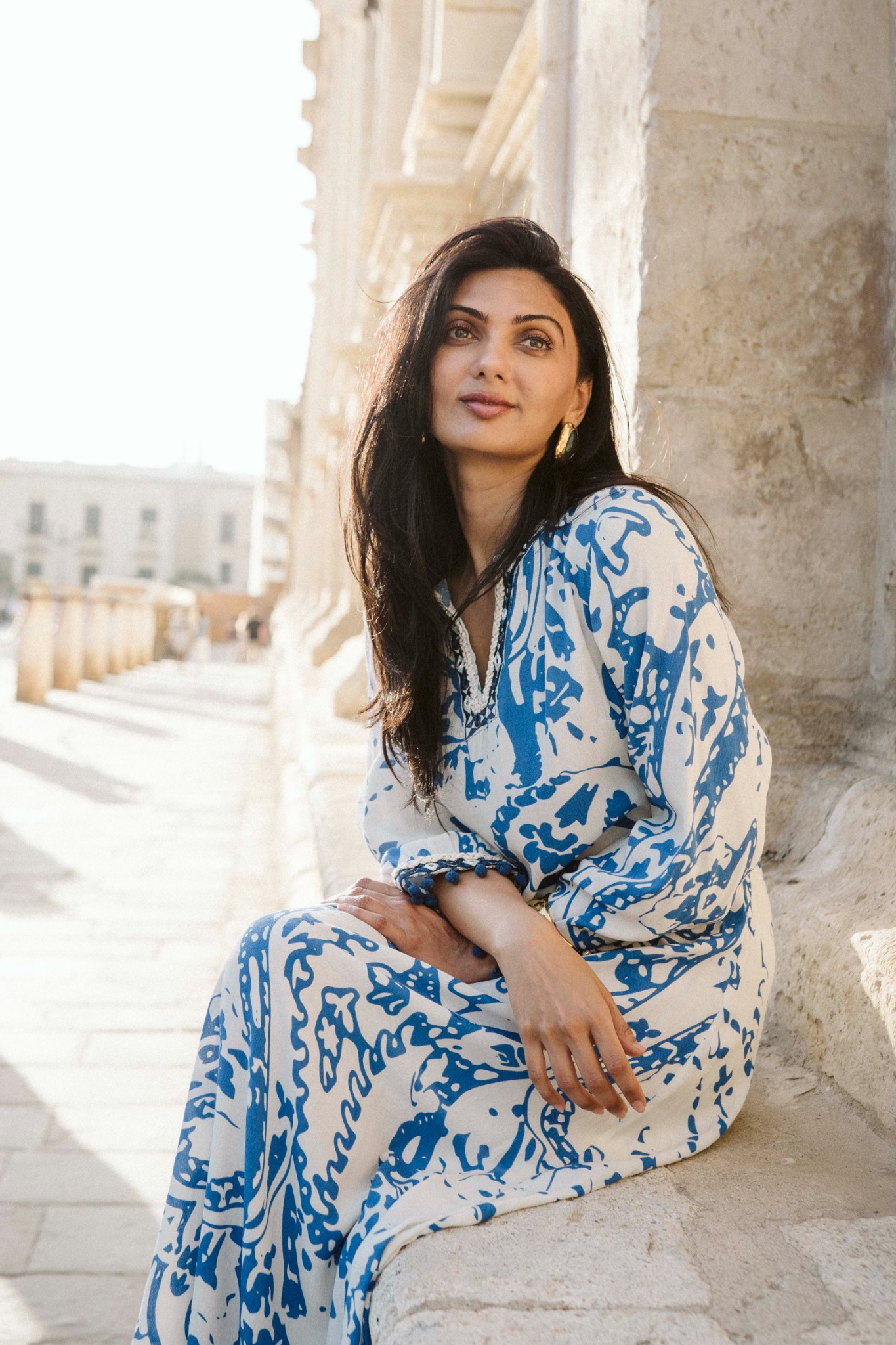 Portrait of Bijal seated outdoors